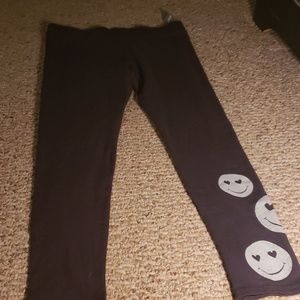 Casual black pants with  cute smiles  on the botto